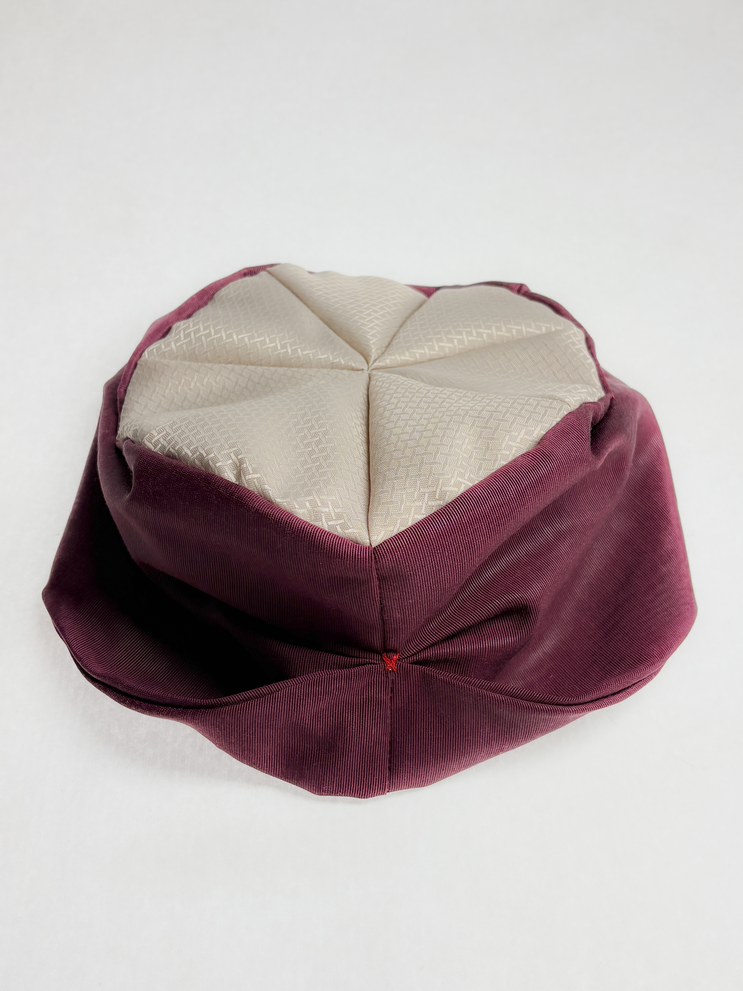 man walking in front of textured wall